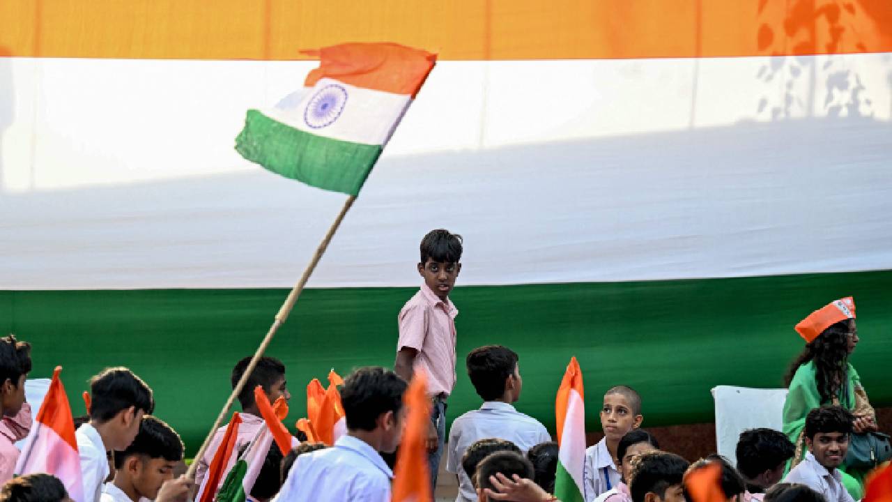 With encouraged patriotism across the nation, school students holding Indian national flags during the 'Har Ghar Tiranga' campaign, held to encourage citizens to hoist the national flag in every house ahead of the country's Independence Day, in New Delhi, on Tuesday